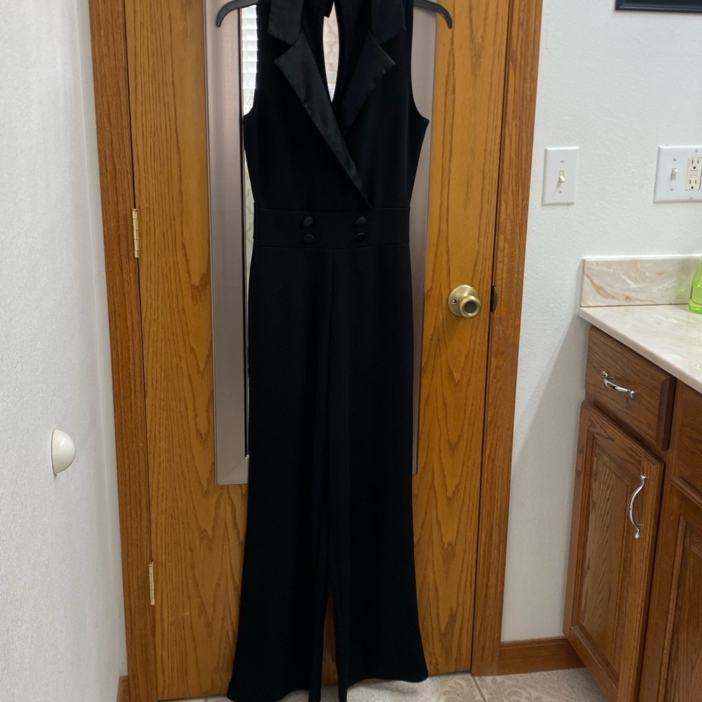 Sleek Black Pantsuit with Plunging Neckline and Wide-Leg Design